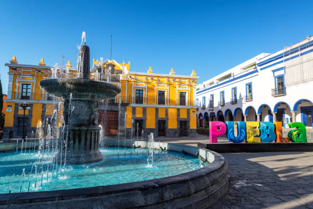 Fountain, theater, and Puebla sign in historic Puebla, Mexico